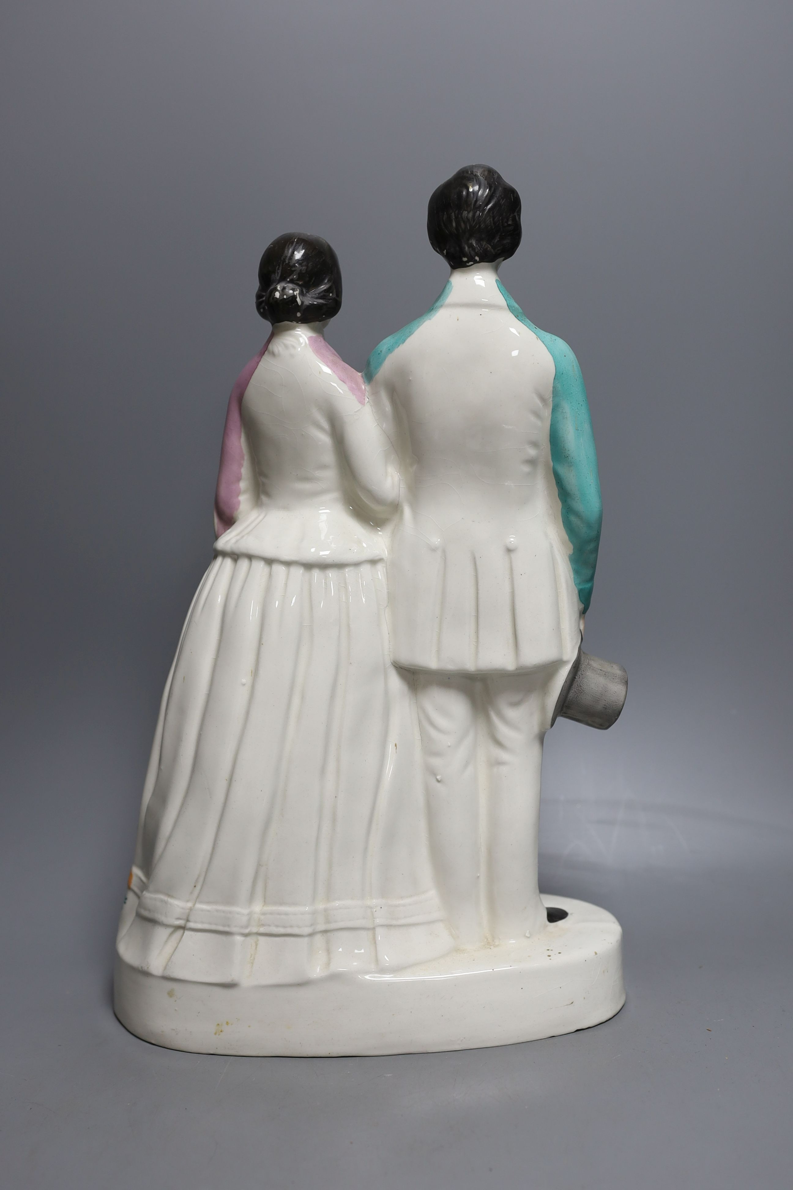 A Staffordshire portrait group of a couple possibly Victoria and Albert. 37cm